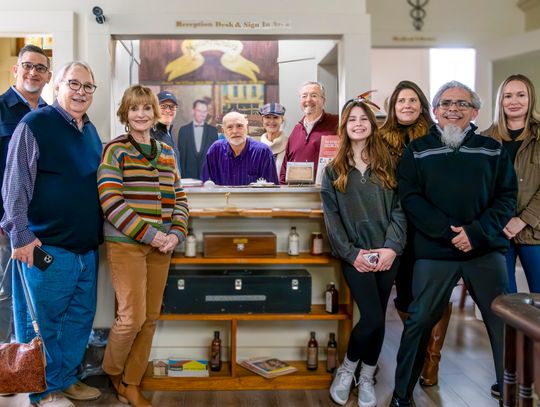Reuss’s family members and muralist Rafael Acosta gathered for the unveiling of Founders’ Mural on February 22 at the Pharmacy & Medical Museum.