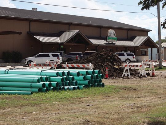 The sewer line across from 5D Steakhouse has collapsed and is being replaced with PVC pipe. STAFF PHOTO