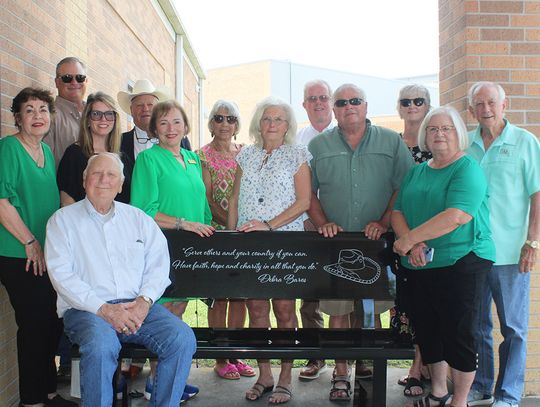 Debra Baros honored with bench, tree dedication