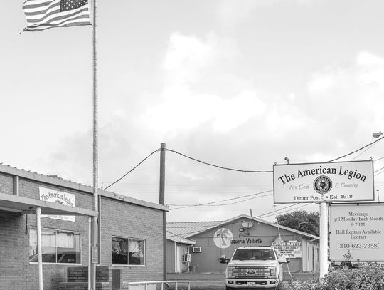The flag flies over the little-changed facade of the Dinter Post #3. Cuero’s American Legion was the third post chartered in the United States, thus the number 3. Cuero’s legionnaires were so enthusiastic they incorporated on July 1, 1919, before the chartering of the national American Leg...