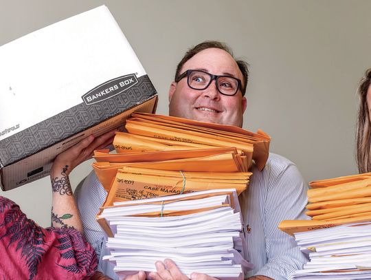24th Judicial District Attorney Brian Cromeens and District Administrator Whitney Smith strain under the paper load of _les that are equivalent to 50 court cases. That is half of a typical court docket of 120 cases. Meanwhile, Leigh Ann Harryman continues to add more _les to their workload...