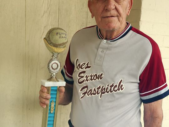 Roger Weise, 85, holds his Perfect Game trophy from a 1979 game he pitched. Weise and two fellow fastpitch teammates from Yoakum will be inducted into the FastPitch Legends Hall of Honor on November 16. (Staff photos)