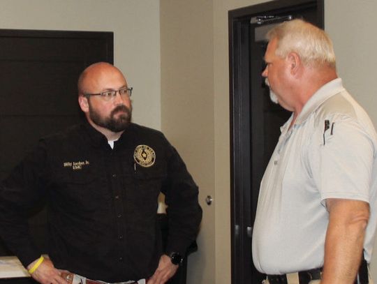 Billy Jordan, the DeWitt County Emergency Management Coordinator, speaks with Yoakum Police Officer Mike Pierman after the school safety meeting. (Staff photo)
