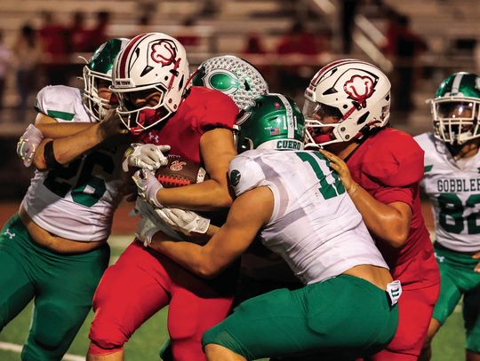 The Gobbler defense takes down a Robstown player in the last regular game of the season. (Photo by Mike Cantu)