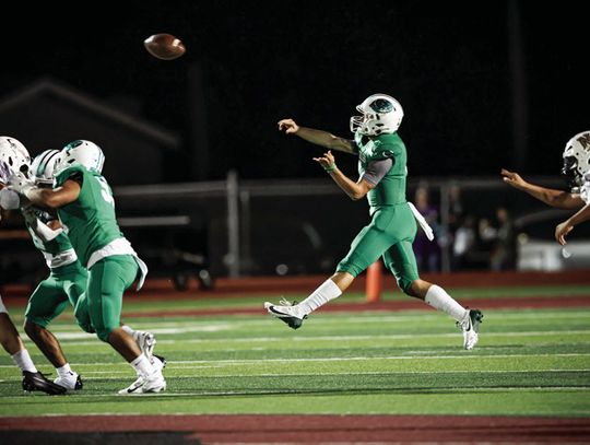Quarterback Jaxxon Marie throws a bullet pass to a Gobbler receiver against Navarro on Friday. Cuero prevailed (56-21) to move forward in the playoffs. (Photo by Mike Cantu)