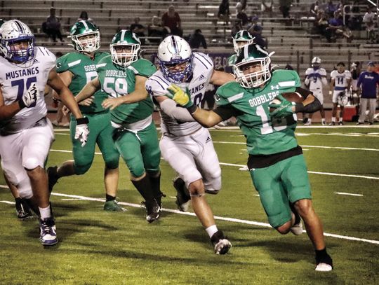Jaxon Timpone gets yards on a run against Ingleside. Cuero won Friday’s match against the Mustangs, 40-14. (Photo by Sonya Timpone)