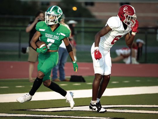 Gobbler wide receiver Brayden Hernandez scores a touchdown during the 2nd quarter against Columbus. (Photo by Mike Cantu)