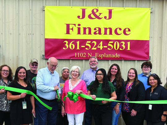 The Cuero Chamber of Commerce hosted a ribbon cutting to celebrate the re-opening of J &amp; J Finance, which is owned by Wayne and Sherry Toney, center. (Staff Photo)