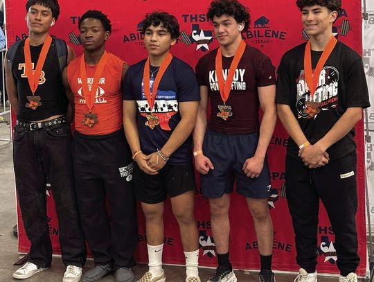 Wildcat senior Johnathan Guerrero (center) won the State Powerlifting Championship in the 132 pound weight class.
