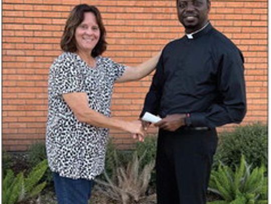 The Catholic community and St. Michael’s Catholic School received donations from Mrs. John C.C. Hamilton. (Contributed Photo)