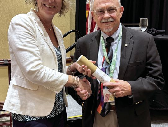 DeWitt County Judge Daryl Fowler accepts his Commissioners Court Advanced Curriculum Certificate of Achievement from Comal County Commissioner Jen Crownover, 2023-24 President of the County Judges and Commissioners Association of Texas. CONTRIBUTED PHOTO