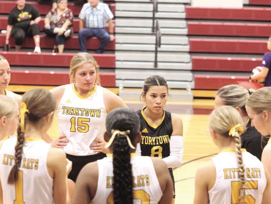 The team huddles together to listen to Head Coach Ashtyn Henkes during a timeout against Runge. CONTRIBUTED PHOTOS