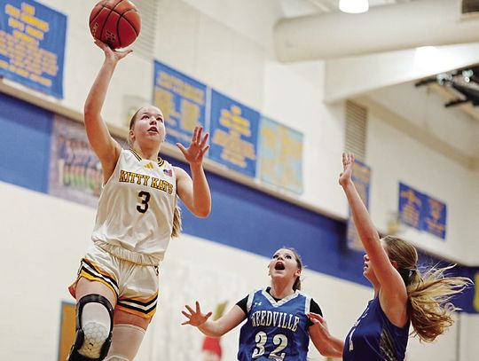 Kitty Kat senior Sydnie Krueger goes up for two points against Needville on December 27. The team won 53-19 in its first game of the tournament in Louise. PHOTOS BY VALERIE STUART