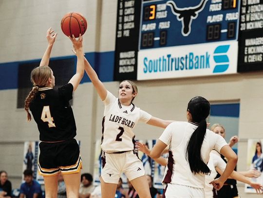 Kitty Kat freshman Palyn Koopmann shoots a jumper over an Agua Dulce defender.