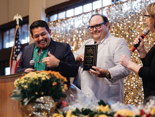 Weber Motor Company’s Jon Eric Rodriguez, left, won the World Series of Cuero “Last Business Standing” award at the Cuero Chamber of Commerce “Carnival of Success” banquet on March 13. Rodriguez and Emily Weatherly, right, emceed the evening, so District Attorney Brian Cromeen, center, pre...