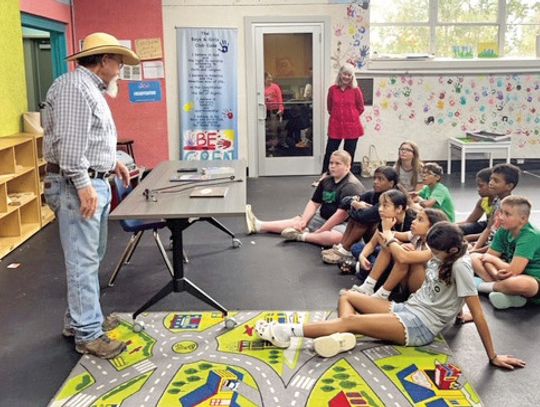 Joe Adams tells stories about the Chisholm Trail to the children at the Cuero Boys and Girls Club. (Contributed