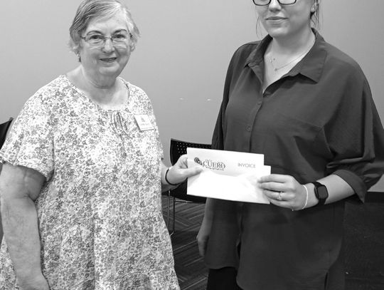 Barbara Nuchels with the DeWitt County Historical Commission delivers a donation of $856.98 to Librarian Katelynn Meitzen for half the cost of the Ancestry Library Edition, which is available for use free of charge at the Cuero Municipal Library. (Contributed photo)