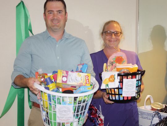Jay Babcock (L) and Cory Smith (R) hold raffle baskets at the Cuero Home Health office, 613 Esplanade. Proceeds from the ongoing raffle will help homebound patients with extra necessities during the Christmas holidays. Tickets can be purchased for $5 at the office during business hours wit...
