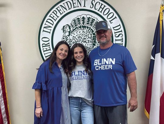 Jaydie Cooper is pictured with her parents Alexis and Justin Cooper after signing a commitment to cheer at Blinn College. (Contributed Photo)