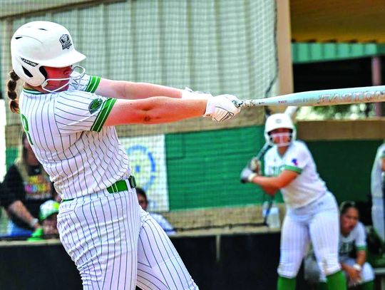 Julianna Cox blasts one over during the game against Wimberley. Cox had two home runs in the series.