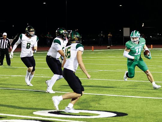 Conner Kubesch rushes for yards against Rockport in the Gobbler’s first district game. (Photo by Mike Cantu)