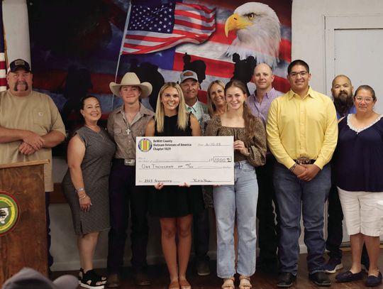 This year’s DeWitt County VVA Scholarship winners gather with their families at the awards dinner on June 10. Graduates pictured near the symbolic check, from left, Jackson Tam of Nordheim, Alexis Flessner of Cuero, Olivia Joyt of Yoakum and Pedro Villanueva of Nordheim. Not pictured is Co...