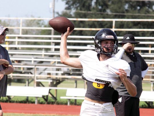 Quarterback Brody Metting passes on a play.