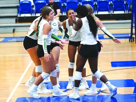 The Lady Gobblers celebrate a kill by Kyara Denson. The team prevailed over St. Joe 3-1. (Submitted Photo)