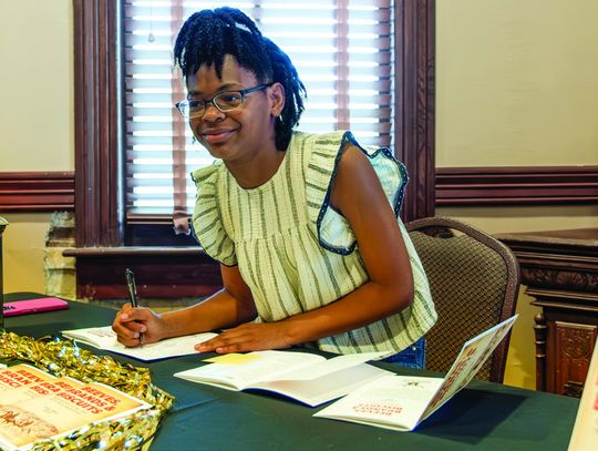Dalori Bland, student author of “My Journey to Kansas”, writes from the _rst-person perspective of an eagle watching the cattle drive. (Photos by Ele Chew, Cuero Record Reporter )