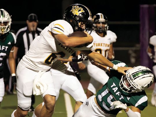 Brody Metting plows over his opponent. PHOTO BY ANDREW HAHN