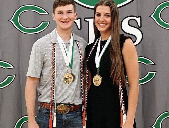 J.R. Bishop and Arissa Carbonara pause after the recent Cuero High School Awards Ceremony with their medals for valedictorian (Bishop) and salutatorian (Carbonara).