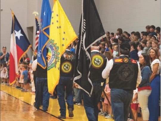 Members of the Yorktown VFW Command Post 8136, Yorktown American Legion Post 272 and the Vietnam Veterans of America Chapter 1029 present the flags during the Yorktown ISD Veterans Day Ceremony on November 11. CONTRIBUTED PHOTOS