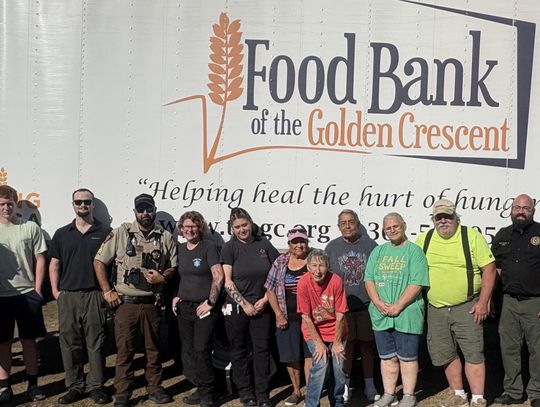 Volunteers unload distribution food