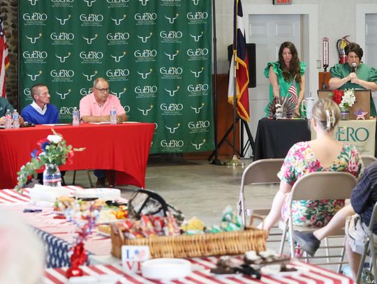 Executive Director of the Cuero Chamber of Commerce Angie Cuellar welcomes the audience to a Candidate Forum, which started with the three candidates for two at-large city council seats. From left are, Adam Arroyo, Russell Mobley and Charles Tounley.