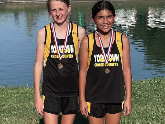 Yorktown 7th grade girls Camille Person (left) and Meigh Naranjo (right) medaled in 6th and 7th place respectively at the District 31-2A JH Cross Country Meet. CONTRIBUTED PHOTOS