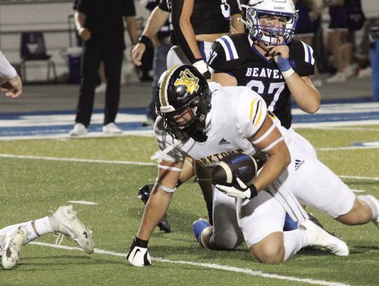 Rau picks up a fumble against the Beavers. PHOTOS BY DEIRDRE ALEXANDER