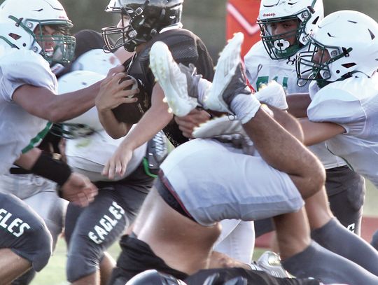 A Wildcat charges upfield with a slew of defenders trying to bring him down. PHOTOS BY DEIRDRE ALEXANDER