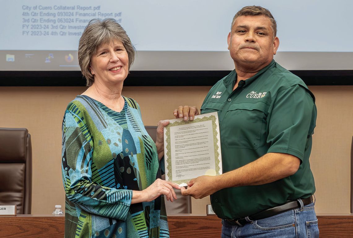 Alice Towery Gilroy, the daughter of Ken Towery, receives a proclamation from Mayor Emil Garza commemorating her father’s 1955 Pulitzer Prize for Local Reporting. The proclamation also encourages observance of National News Literacy Week, Feb. 3-7. For more information, see the News Litera...