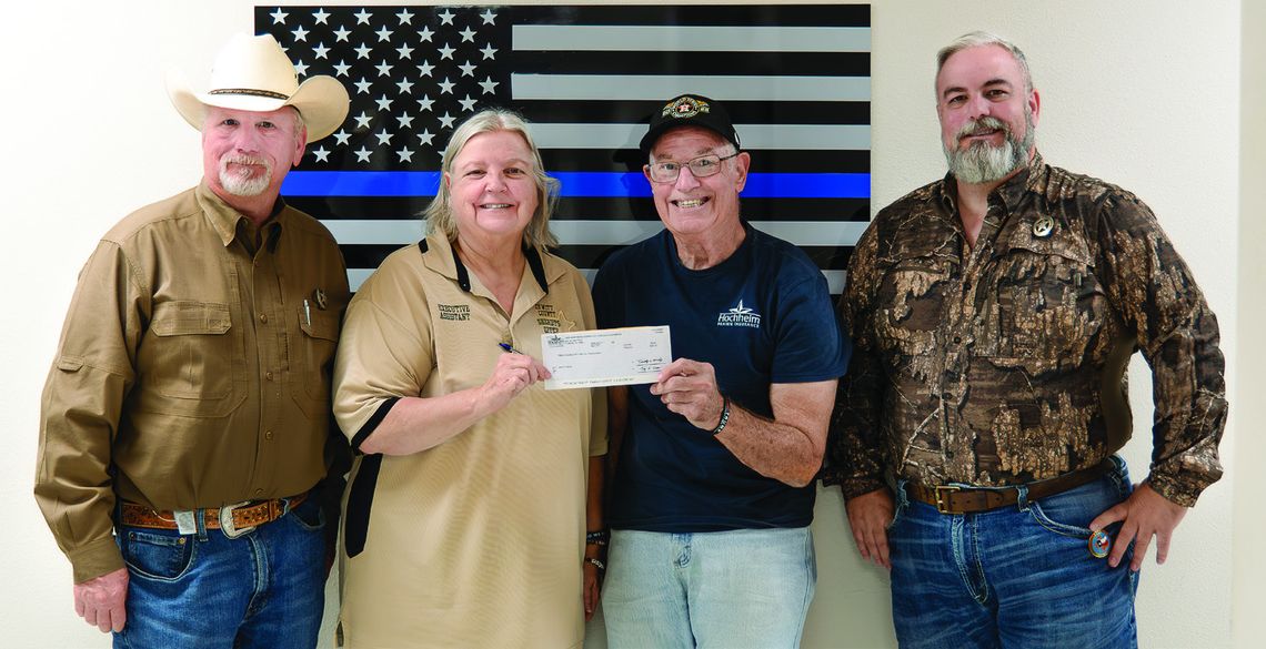 Hochheim Prairie Insurance Branch 2 donates $250 to DeWitt County’s Deputy Santa program. Pictured L-R: Sheriff Carl Bowen, Hochheim Prairie President Ronnie Dietz, Sheriff’s Executive Assistant Kimberly Jalufka, and Chief Deputy John Garoni. PHOTO BY ELE CHEW