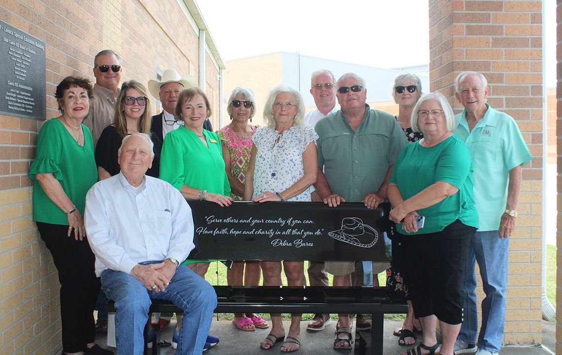 Debra Baros honored with bench, tree dedication