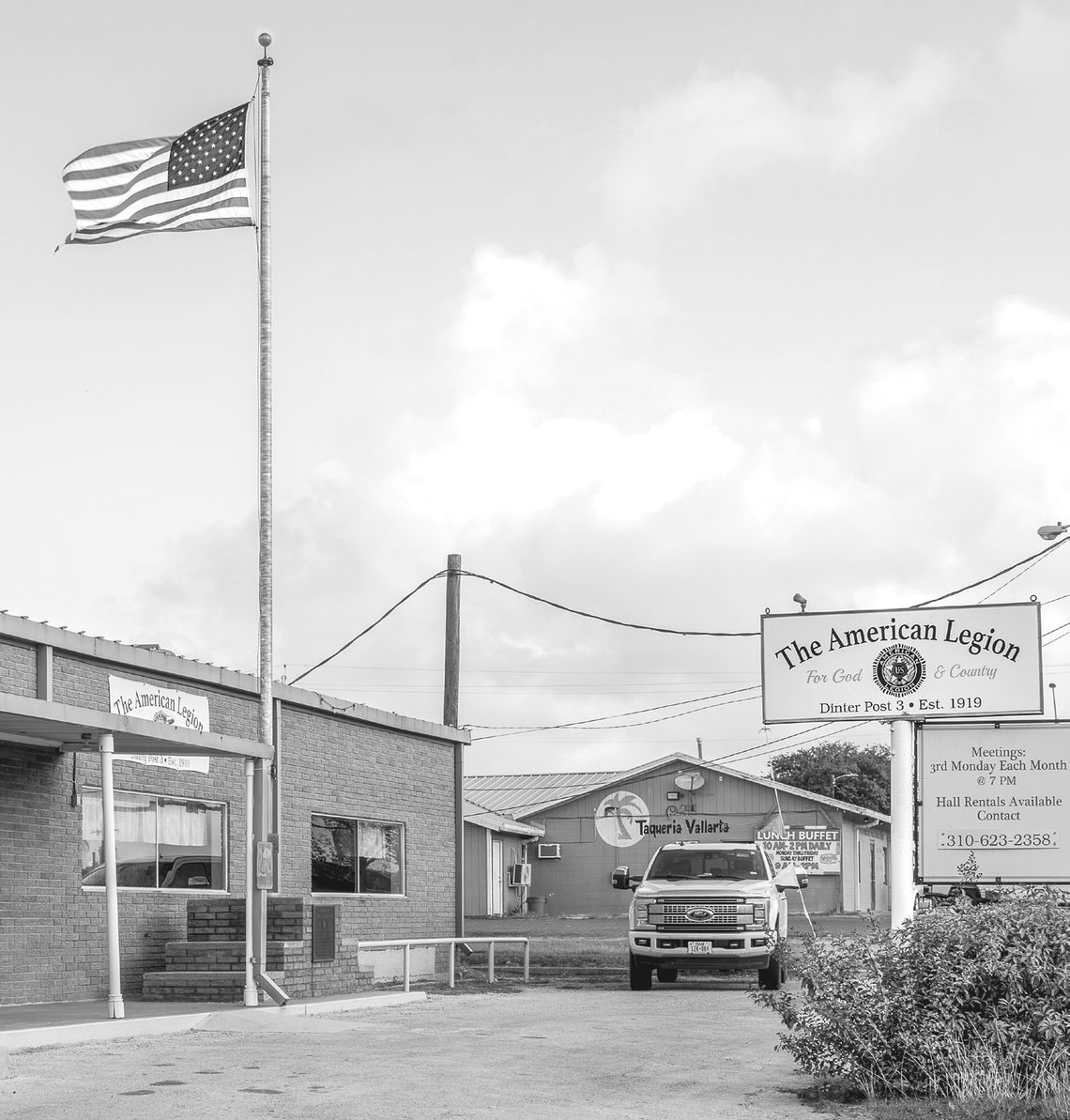 The flag flies over the little-changed facade of the Dinter Post #3. Cuero’s American Legion was the third post chartered in the United States, thus the number 3. Cuero’s legionnaires were so enthusiastic they incorporated on July 1, 1919, before the chartering of the national American Leg...