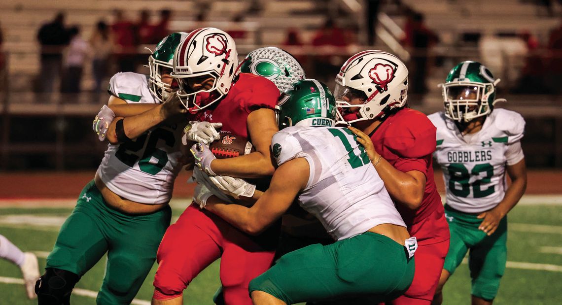 The Gobbler defense takes down a Robstown player in the last regular game of the season. (Photo by Mike Cantu)