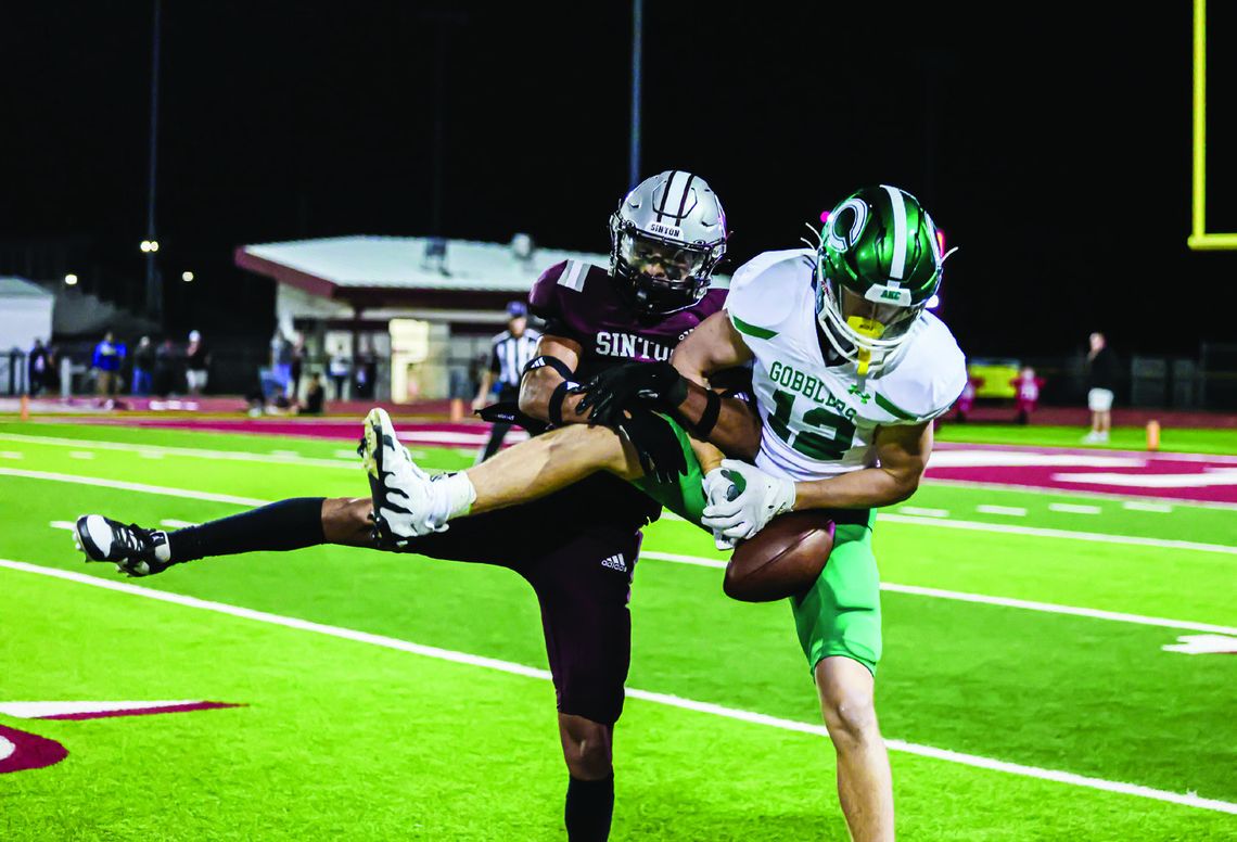 Walker Dietze tries to control the ball in the Sinton matchup. (Photo by Mike Cantu)