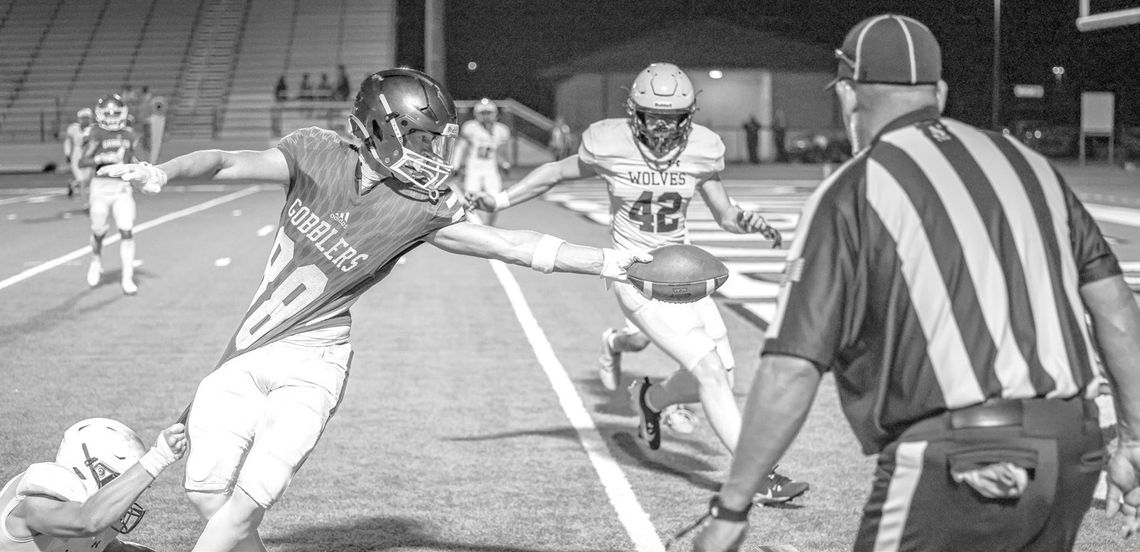 Isaac Ward makes a touchdown. (Photo by Mike Cantu)
