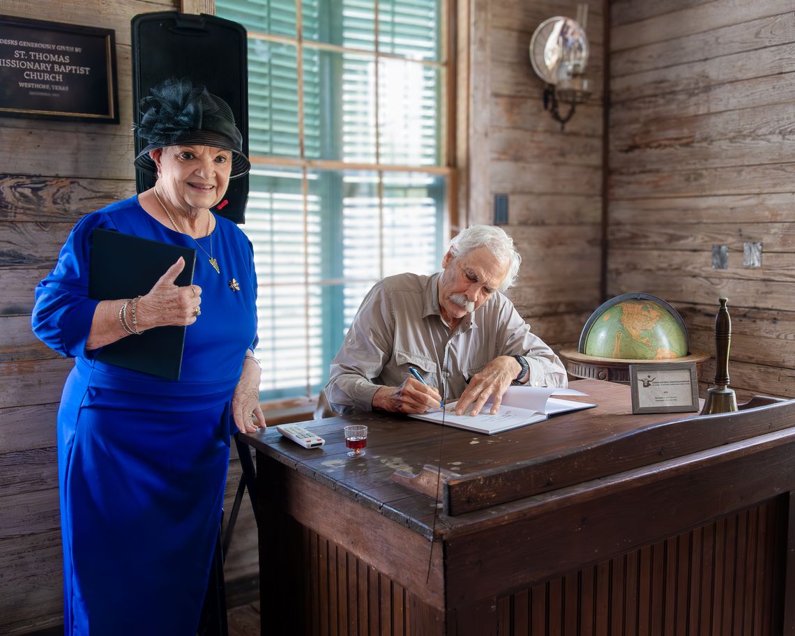 Beverly Bruns, who discovered an original publication of the book in her attic, has Dr. Kearney sign the new release.