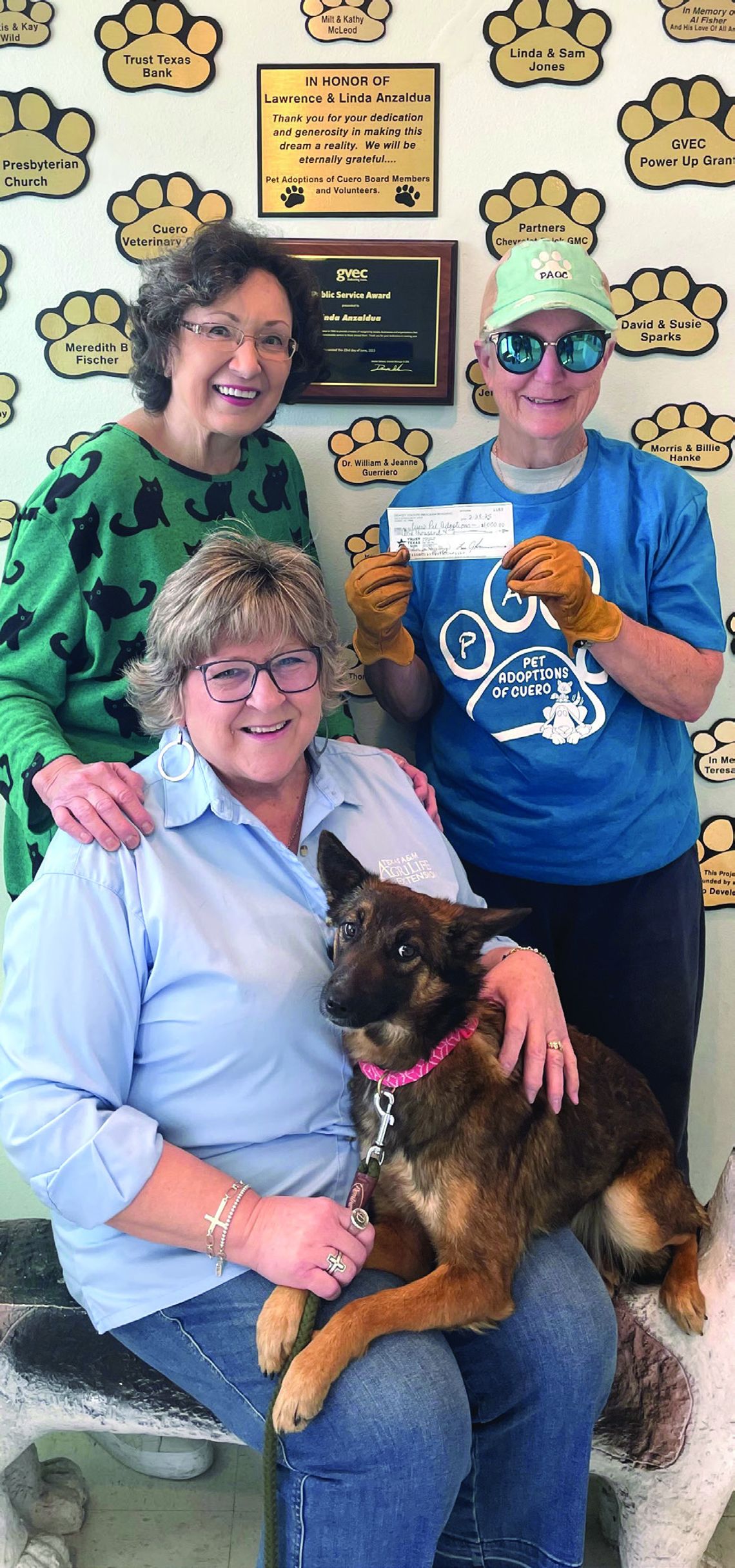 Denise Goebel, event coordinator of Hometown Harvest Dinner, recently made a donation to Pet Adoptions of Cuero board members and volunteers Linda Anzaldua and Nelda Huber. The annual outdoor dinner on Cuero’s Main Street raises money for local nonpro_ts. (Contributed Photo)