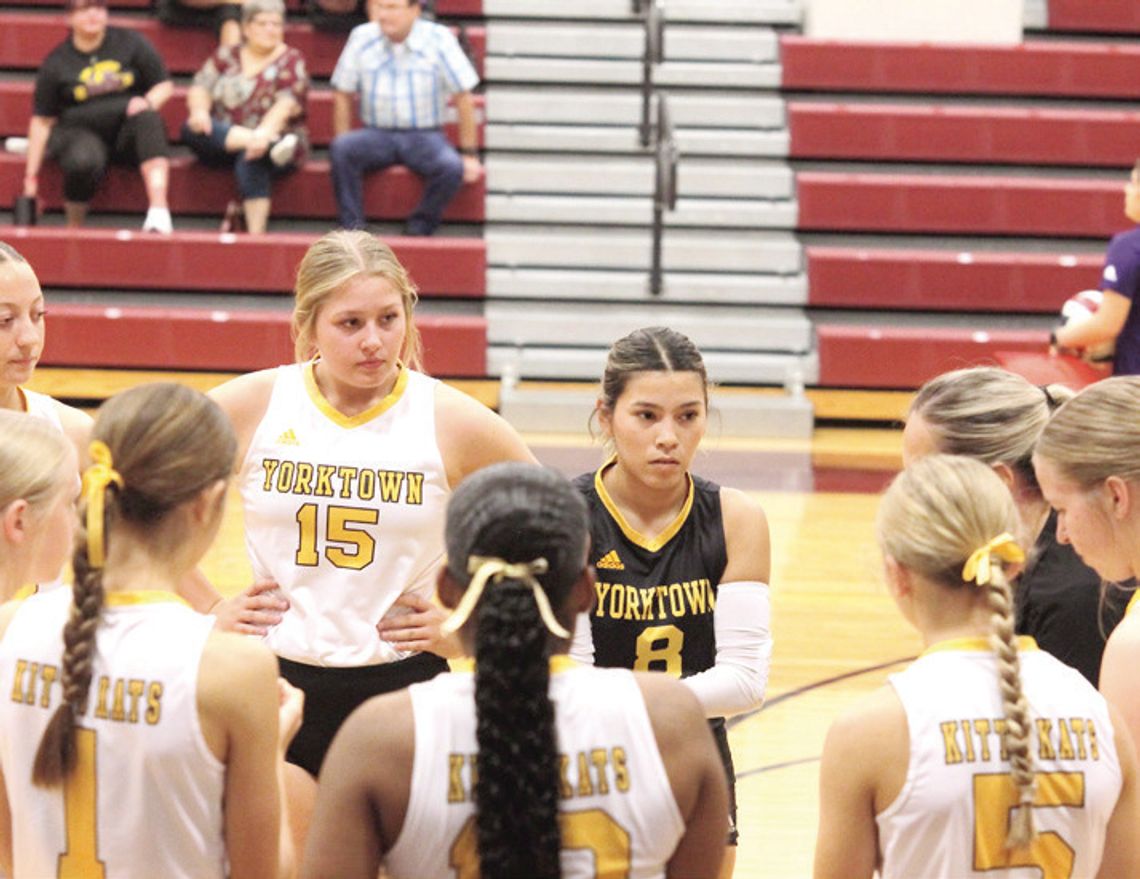 The team huddles together to listen to Head Coach Ashtyn Henkes during a timeout against Runge. CONTRIBUTED PHOTOS