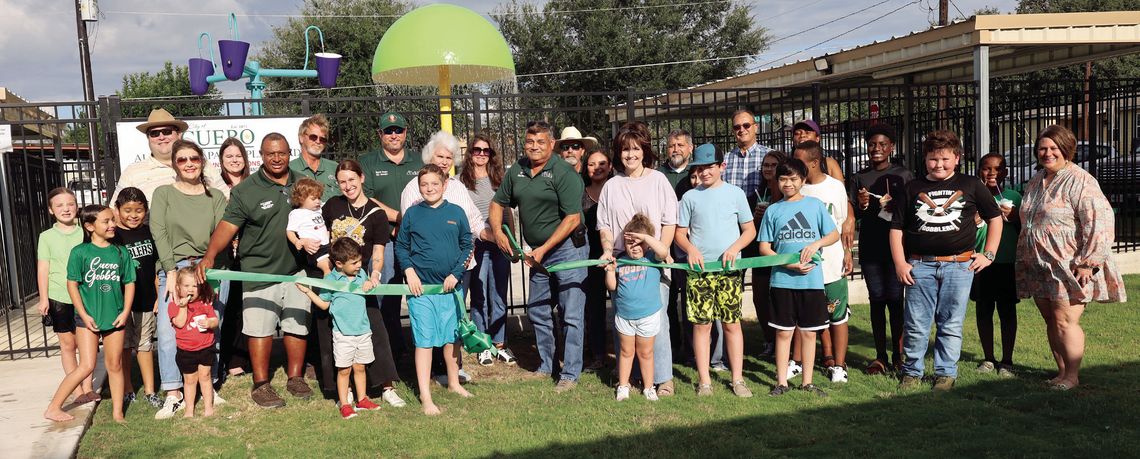Mayor Emil Garza cut the grand opening ribbon for the new Alexander Park Splash Pad along with former Mayor Sarah Post Meyer and other City of Cuero leaders on September 5. (Staff photo)