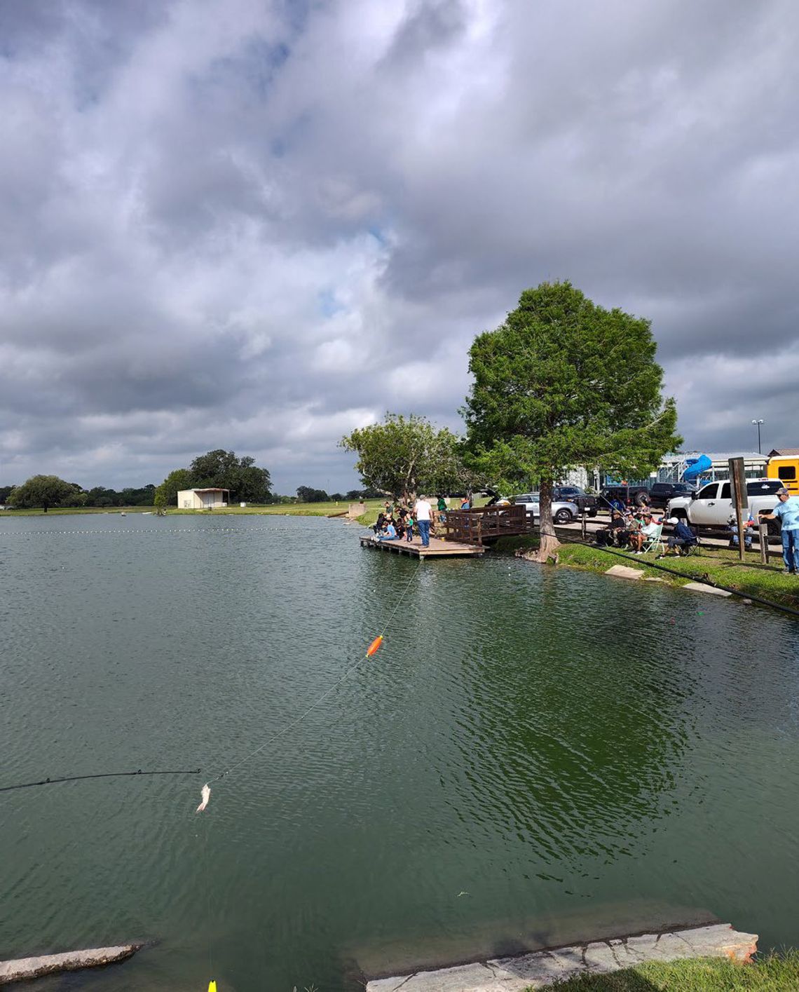 Kids hook catfish in Cuero City Park Lake