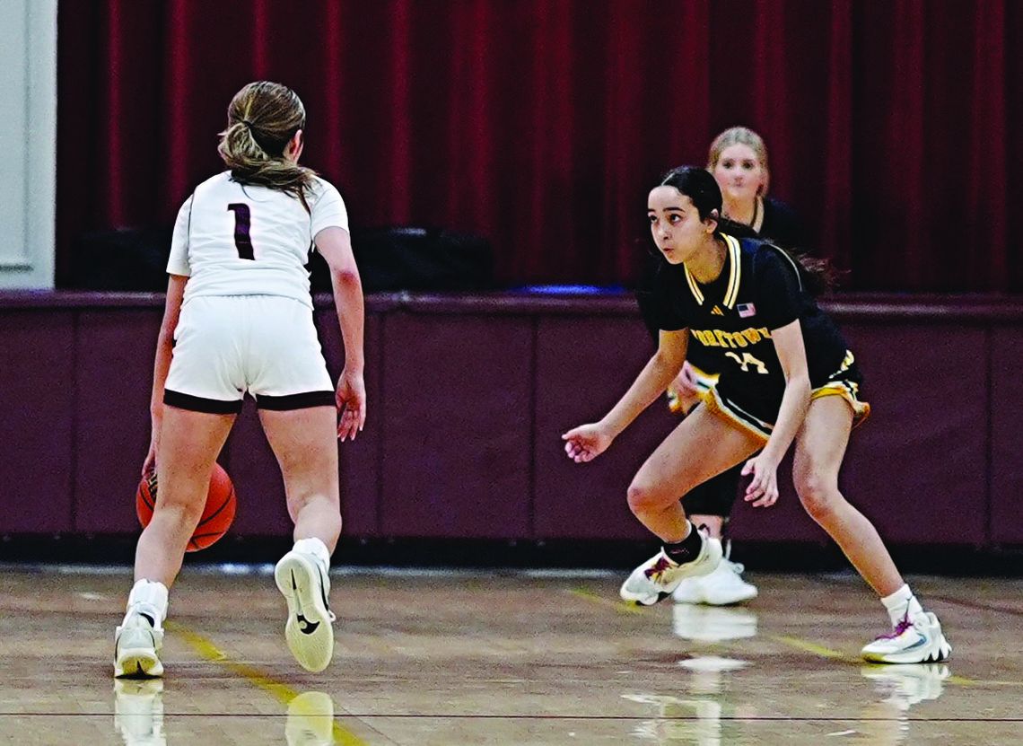 Kitty Kat freshman Trinity Flores locks down the Pettus point guard. PHOTOS BY VALERIE STUART